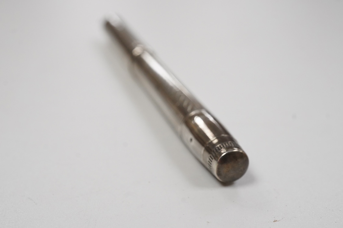 A Mabie Todd & Co. Swan Sterling silver twist filler, Made in England with 14ct. gold nib